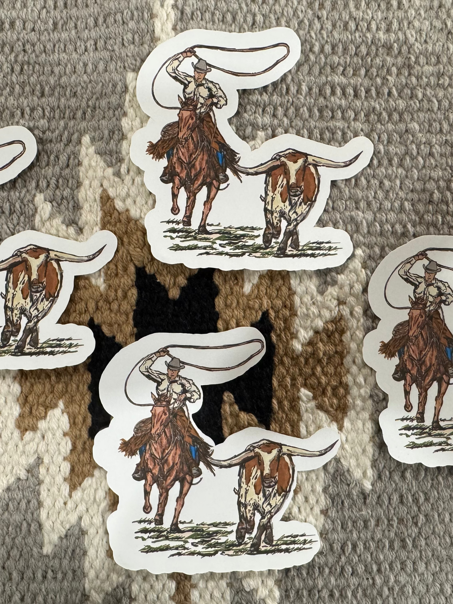 Cowboy roping a longhorn sticker